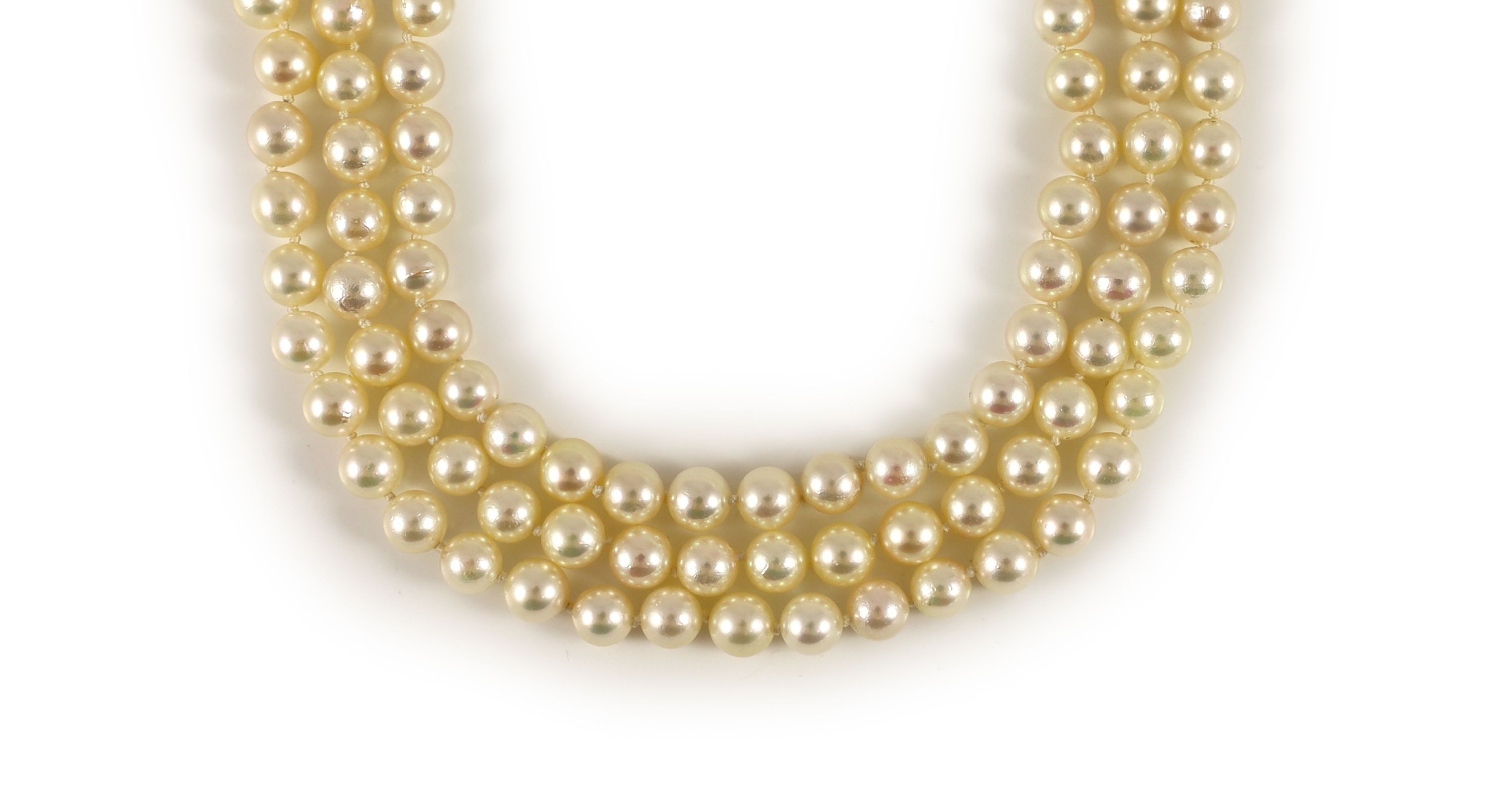 A modern triple strand cultured pearl necklace, with a 14k gold, cultured pearl and diamond set clasp